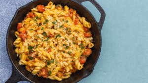 Dagtrips in Noord-Holland A beautifully arranged dish of creamy mushroom risotto, garnished with fresh parsley and served in a rustic bowl, with ingredients like mushrooms, parmesan, and herbs displayed around it.